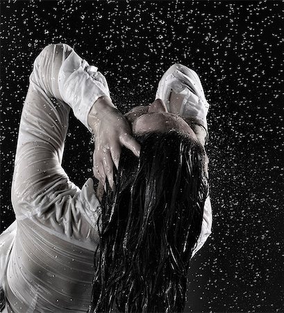 drenched - Rear view of woman head back, drenched in rain Stock Photo - Premium Royalty-Free, Code: 649-08543283