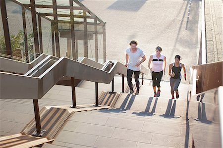 running - Two women and man runners running up urban stairway Stock Photo - Premium Royalty-Free, Code: 649-08543345