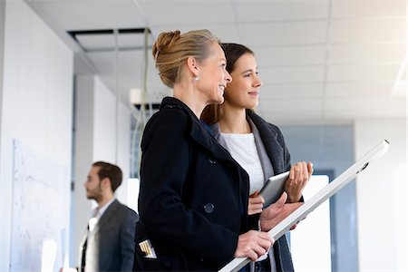 simsearch:630-06724175,k - Businesswomen with blueprint and digital tablet inspecting in new office Stock Photo - Premium Royalty-Free, Code: 649-08543695