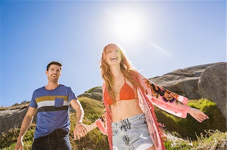 simsearch:649-08239088,k - Couple outdoors, holding hands, laughing Stock Photo - Premium Royalty-Free, Code: 649-08543905