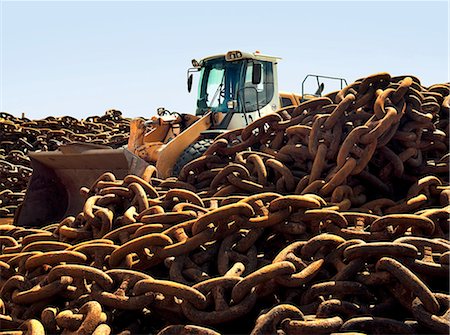 Rusted chains and excavator in scrap yard Stock Photo - Premium Royalty-Free, Code: 649-08564023