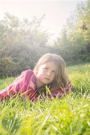 simsearch:649-09078617,k - Girl lying down in field during summer Stock Photo - Premium Royalty-Free, Code: 649-08564375