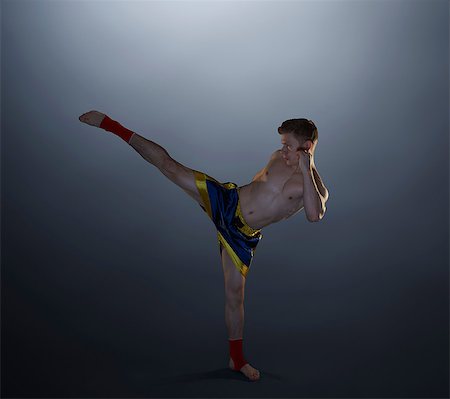 simsearch:649-07238777,k - Studio shot of young male kick boxer Stock Photo - Premium Royalty-Free, Code: 649-08565225
