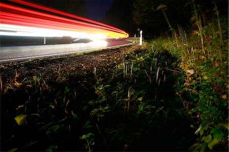 simsearch:614-06719755,k - Roadside with light streaks from cars Stock Photo - Premium Royalty-Free, Code: 649-08560076