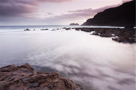 Waves washing over rocks on beach Stock Photo - Premium Royalty-Free, Code: 649-08560802