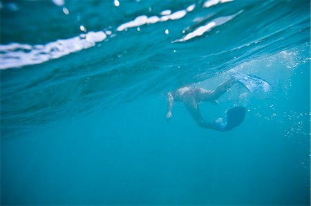 Woman in fins swimming in ocean Stock Photo - Premium Royalty-Free, Code: 649-08560959