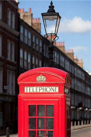 Red telephone box on city street Stock Photo - Premium Royalty-Free, Code: 649-08561601