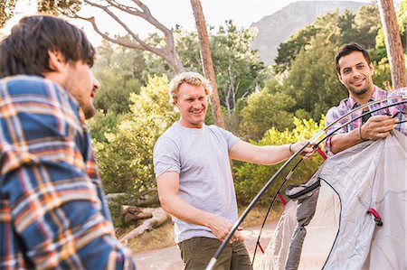 erect - Three men putting up tent in forest, Deer Park, Cape Town, South Africa Stock Photo - Premium Royalty-Free, Code: 649-08576562