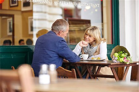Mature dating couple chatting together at sidewalk cafe table Stock Photo - Premium Royalty-Free, Code: 649-08577195
