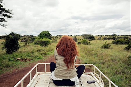 simsearch:649-08086253,k - Woman enjoying ride on top of vehicle in wildlife park, Nairobi, Kenya Stock Photo - Premium Royalty-Free, Code: 649-08660889