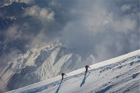 Two climbers ascending a snowy slope, Alps, Canton Wallis, Switzerland Stock Photo - Premium Royalty-Free, Code: 649-08661170