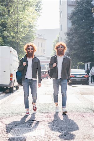 simsearch:649-08702620,k - Young male hipster twins with red hair and beards strolling on city road Stock Photo - Premium Royalty-Free, Code: 649-08702642