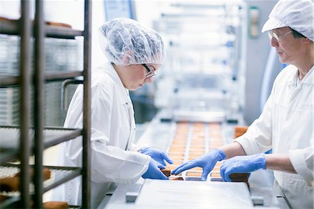 Factory workers on food production line Stock Photo - Premium Royalty-Free, Code: 649-08703175