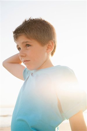 simsearch:649-09078617,k - Boy with hand on head looking away Stock Photo - Premium Royalty-Free, Code: 649-08703184