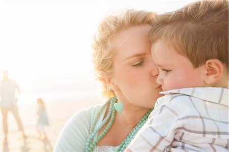 simsearch:649-07803505,k - Mother on beach kissing son on cheek Stock Photo - Premium Royalty-Free, Code: 649-08703186