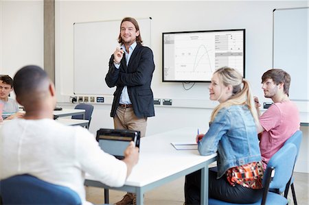 simsearch:614-07031973,k - Male lecturer questioning students in higher education college classroom Stock Photo - Premium Royalty-Free, Code: 649-08714100