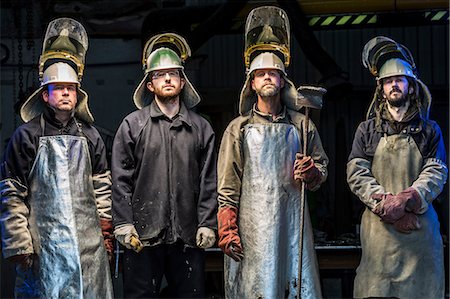 foundry worker - Portrait of four male foundry workers wearing protective clothing in bronze foundry Stock Photo - Premium Royalty-Free, Code: 649-08715040