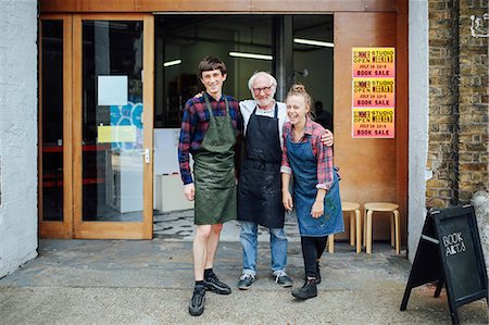 small business portrait full body - Family portrait of senior craftsman with daughter and son outside print workshop Stock Photo - Premium Royalty-Free, Code: 649-08744934