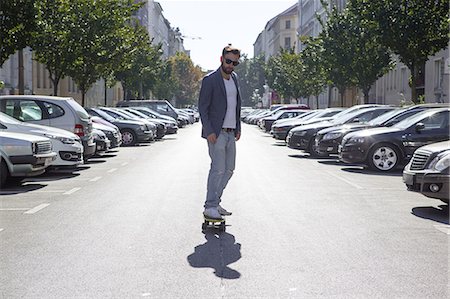 Man skateboarding in street, Berlin, Germany Stock Photo - Premium Royalty-Free, Code: 649-08766192