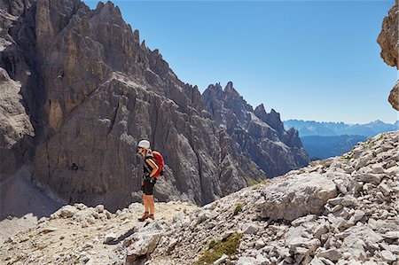 simsearch:614-07240106,k - Female hiker looking out at Dolomites, Sexten, South Tyrol, Italy Stock Photo - Premium Royalty-Free, Code: 649-08766284