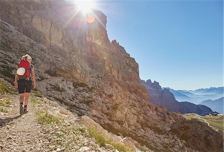 simsearch:614-07240106,k - Rear view of female hiker hiking up Dolomites, Sexten, South Tyrol, Italy Stock Photo - Premium Royalty-Free, Code: 649-08766287