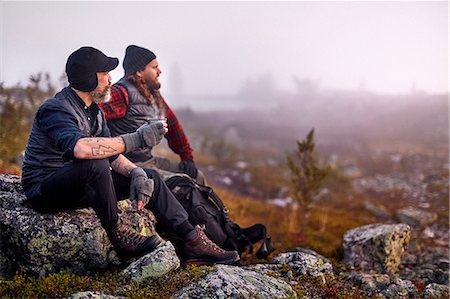 Hikers relaxing with coffee on rocky field, Sarkitunturi, Lapland, Finland Stock Photo - Premium Royalty-Free, Code: 649-08766366