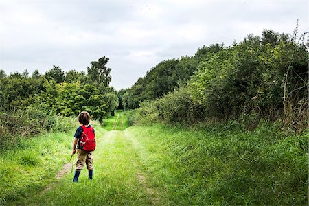 simsearch:649-06845253,k - Rear view of boy with backpack on rural landscape Stock Photo - Premium Royalty-Free, Code: 649-08824235