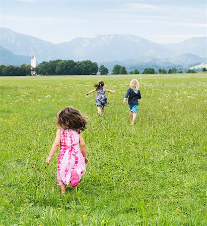 simsearch:649-07761212,k - Rear view of children running in field, Fuessen, Bavaria, Germany Stock Photo - Premium Royalty-Free, Code: 649-08824939