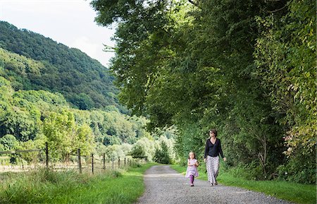 simsearch:649-08306780,k - Mother and daughter walking on rural road, Porta Westfalica, North Rhine Westphalia, Germany Stock Photo - Premium Royalty-Free, Code: 649-08824968