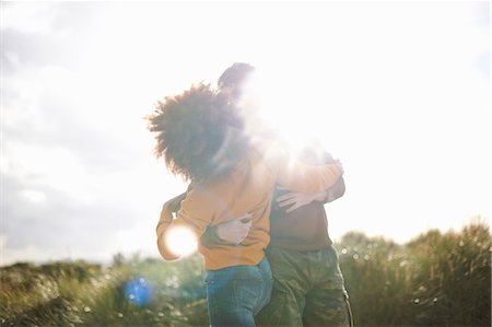 simsearch:614-07194495,k - Couple dancing on grassy sand dune Stock Photo - Premium Royalty-Free, Code: 649-08840023