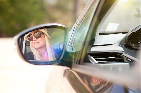 smiling mature woman - Woman looking out of car window Stock Photo - Premium Royalty-Free, Code: 649-08840350