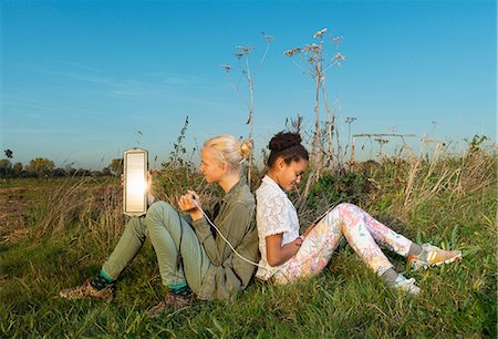 Children using miniature solar cell to power digital tablet, Breda, Netherlands Stock Photo - Premium Royalty-Free, Code: 649-08840454