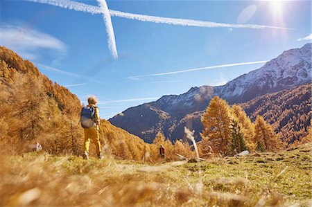 simsearch:614-07240106,k - Woman hiking, rear view, low angle view, Schnalstal, South Tyrol, Italy Stock Photo - Premium Royalty-Free, Code: 649-08840498