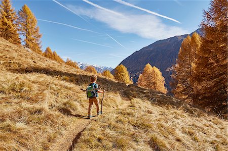 simsearch:649-08086253,k - Young boy hiking along pathway, rear view, Schnalstal, South Tyrol, Italy Stock Photo - Premium Royalty-Free, Code: 649-08840505