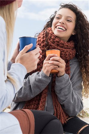 sea woman - Two young women laughing at beach picnic, Western Cape, South Africa Stock Photo - Premium Royalty-Free, Code: 649-08840653