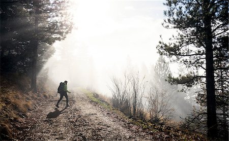 Young woman trekking along pathway, Missoula, Montana, USA Stock Photo - Premium Royalty-Free, Code: 649-08859903