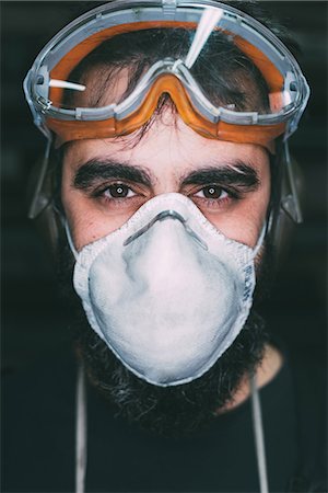 forge - Portrait of male metalworker in dust mask Stock Photo - Premium Royalty-Free, Code: 649-08894128