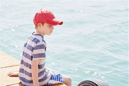 simsearch:649-09078617,k - Boy sitting on houseboat deck, Kraalbaai, South Africa Stock Photo - Premium Royalty-Free, Code: 649-08894447