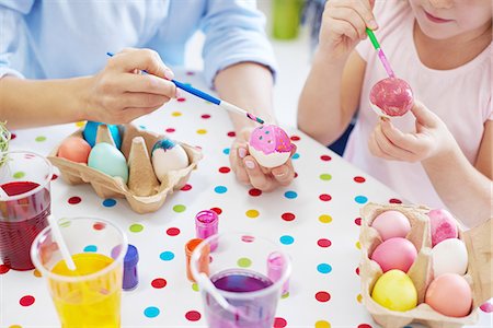 egg box - Cropped shot of woman and daughter's hands painting easter eggs at table Stock Photo - Premium Royalty-Free, Code: 649-08894612