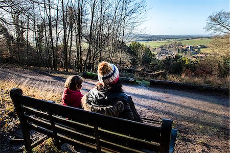 simsearch:695-03386286,k - Mother and son sitting on bench in rural setting, looking at view, rear view Stock Photo - Premium Royalty-Free, Code: 649-08894795