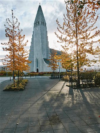 Reykjavik cathedral and trees with autumn leaves,  Reykjavik, Iceland Stock Photo - Premium Royalty-Free, Code: 649-08895159