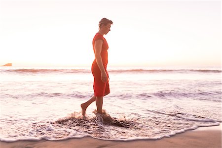 simsearch:649-08900720,k - Mature woman strolling in sea at sunset, Nosara, Guanacaste Province, Costa Rica Stock Photo - Premium Royalty-Free, Code: 649-08900733