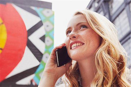 single geometric shape - Woman using mobile phone in street, London, UK Stock Photo - Premium Royalty-Free, Code: 649-08901051