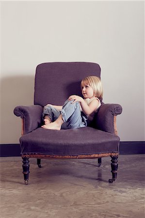 simsearch:649-09078617,k - Girl reclining on vintage armchair gazing Stock Photo - Premium Royalty-Free, Code: 649-08901203