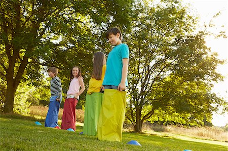 simsearch:649-07520254,k - Girls and boys on start line for sack race in park Stock Photo - Premium Royalty-Free, Code: 649-08901497