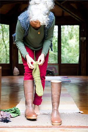 putting - Woman putting on socks and boots Stock Photo - Premium Royalty-Free, Code: 649-08924079