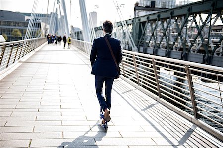 scooter rear view - Businessman on scooter, Hungerford Bridge, London, UK Stock Photo - Premium Royalty-Free, Code: 649-08924118