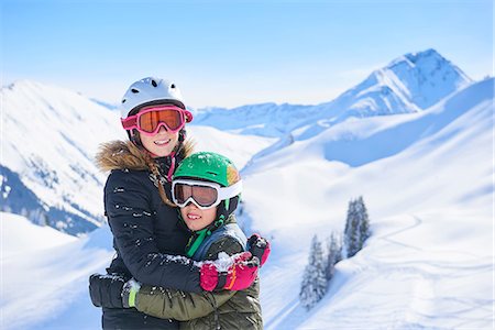 simsearch:649-07239584,k - Portrait of skiing teenage girl and brother hugging in Swiss Alps, Gstaad, Switzerland Stock Photo - Premium Royalty-Free, Code: 649-08924176