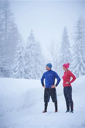 simsearch:649-08924209,k - Female and male runners watching snowfall from track in deep snow, Gstaad, Switzerland Stock Photo - Premium Royalty-Free, Code: 649-08924206