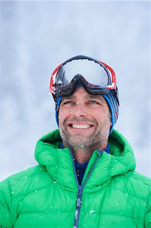 simsearch:649-08924209,k - Portrait of happy mature man in falling snow, Gstaad, Switzerland Stock Photo - Premium Royalty-Free, Code: 649-08924208